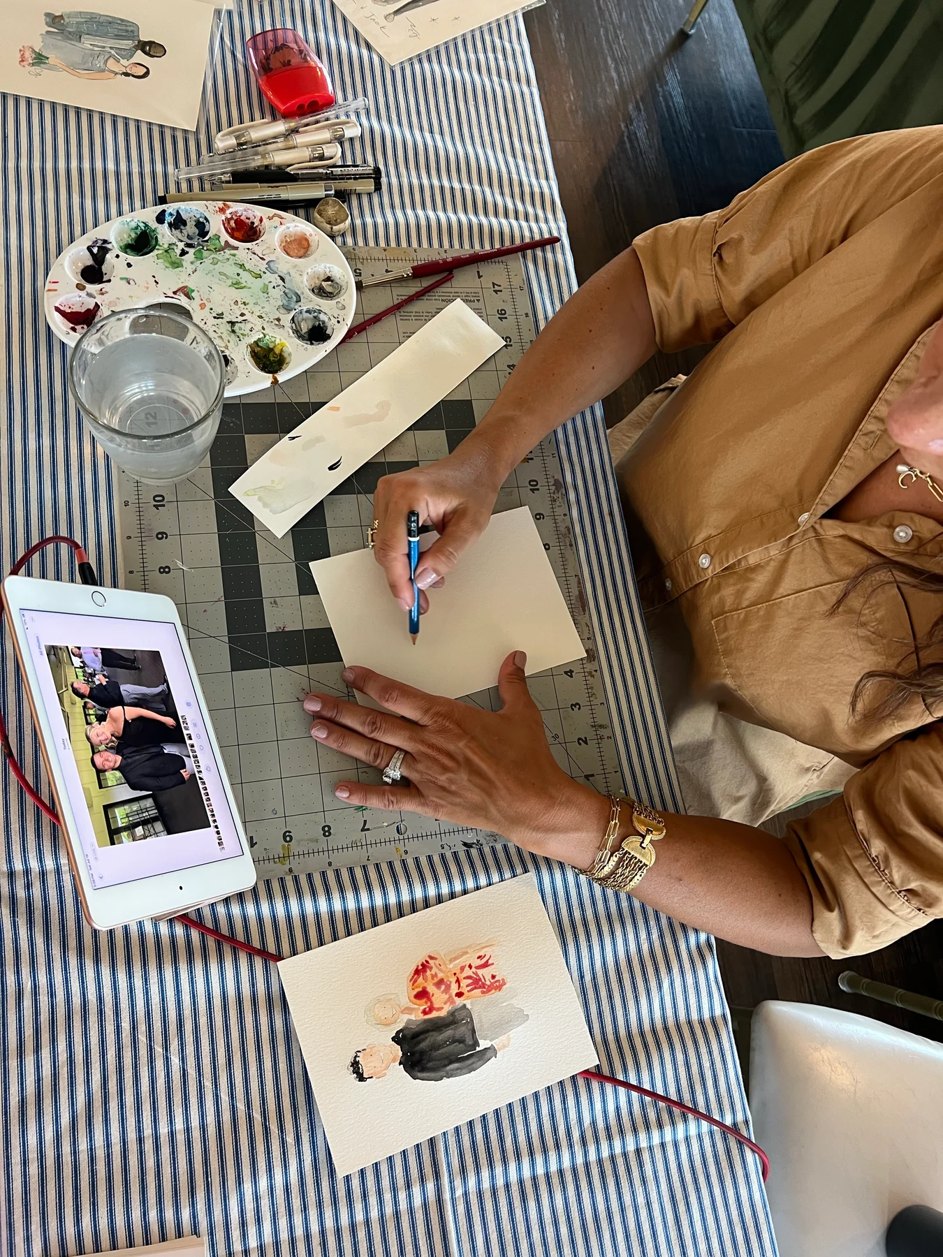An overhead view of Carmen starting a portrait from a guest photograph